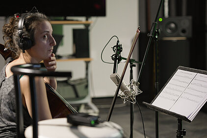 cellist in acoustic studio